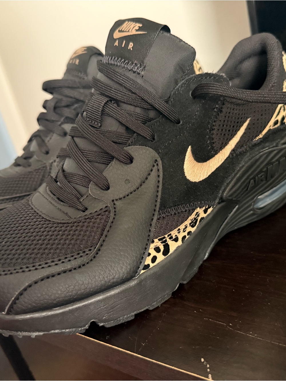 Nike Black Sneakers with Gold Swoosh and Leopard Trim